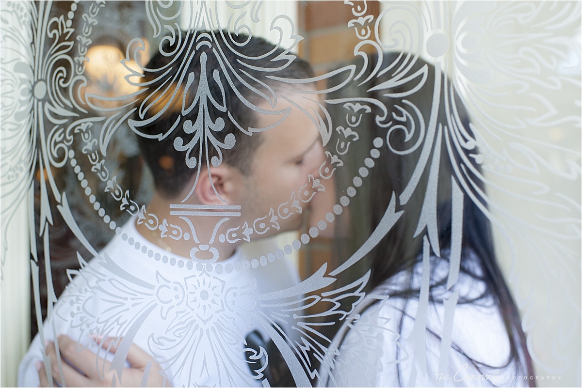 kissing behind glass. 