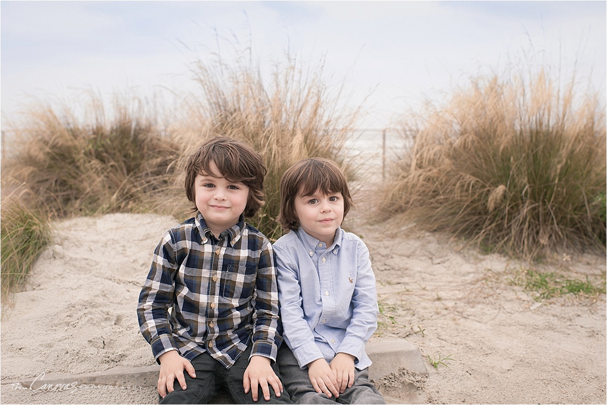 two boys on beach smiling